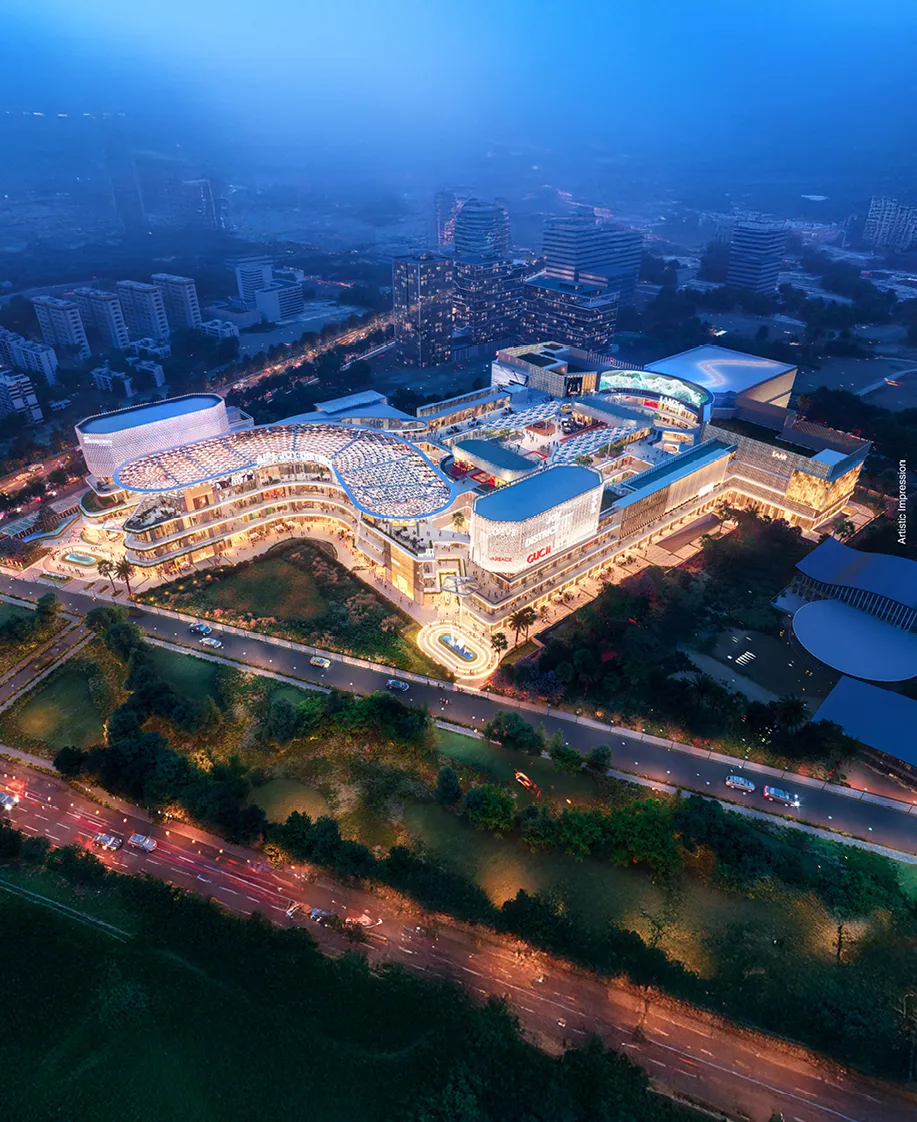 AIPL Joy District exterior at dusk